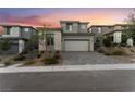 Beautiful two-story home featuring stone accents and a spacious two-car garage and a beautiful brick driveway at 12457 Sunset Sage Ave, Las Vegas, NV 89138