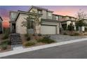 Beautiful two-story home featuring stone accents and a spacious two-car garage and a beautiful brick driveway at 12457 Sunset Sage Ave, Las Vegas, NV 89138