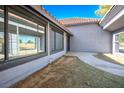 Exterior view showcasing large windows and access to a covered walkway, offering ample natural light and outdoor living space at 1967 N Moapa Valley Blvd, Logandale, NV 89021