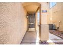 Exterior featuring the address displayed above the front door with a covered entryway at 1988 Villa De Sol St, Las Vegas, NV 89156