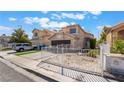 Charming two-story home with a two-car garage, low maintenance front yard, and desert landscaping at 2211 Arborwood Way, Las Vegas, NV 89142