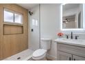 Modern bathroom with sleek fixtures, a glass-enclosed shower, and a stylish vanity with an illuminated mirror at 2621 Bello Dr, North Las Vegas, NV 89030