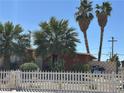 Charming single-story home with desert landscaping and a white picket fence at 3115 Emmons Ave, North Las Vegas, NV 89030