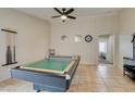Spacious game room featuring a billiards table, ceiling fan, and neutral-toned walls at 4417 Gracemont Ave, Las Vegas, NV 89139