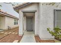 A close-up of the home's entry with the security door at 5012 Naff Ridge Dr, Las Vegas, NV 89131