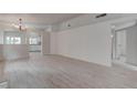 Bright living room with new wood flooring, recessed lights, and updated paint at 5328 Walton Heath Ave, Las Vegas, NV 89142