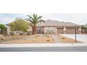 Beautiful home featuring desert landscaping, a tile roof, and a well-manicured front yard at 5815 Pristine Falls Ave, Las Vegas, NV 89131