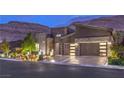 Beautiful modern home featuring a stylish facade, manicured landscaping, and an attached two-car garage at 6103 Stone Rise St, Las Vegas, NV 89135