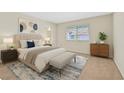 Cozy bedroom featuring a plush bed, a bench, and a serene atmosphere at 7901 Idledale Ct # 102, Las Vegas, NV 89145