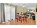 Bright dining area with natural light, table with seating for four, and mirrored wall feature at 7901 Idledale Ct # 102, Las Vegas, NV 89145