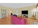 Bright living room featuring laminate floors and comfortable seating at 7901 Idledale Ct # 102, Las Vegas, NV 89145