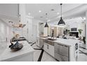 Spacious kitchen featuring stainless steel appliances and island sink at 9 Greely Club Trl, Henderson, NV 89052