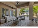 Comfortable outdoor living space featuring stylish seating and calming greenery at 9 Greely Club Trl, Henderson, NV 89052