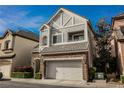 Charming two-story home featuring stone accents, a two-car garage, and manicured landscaping at 9173 Whitekirk Pl, Las Vegas, NV 89145