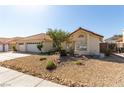 Exterior view of a charming single-story home featuring desert landscaping and a 3-car garage at 1185 Ponce De Leon Ave, Las Vegas, NV 89123