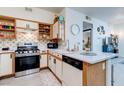 Charming kitchen featuring stainless steel range, contrasting backsplash, and breakfast bar with seating at 5751 Hacienda Ave # 135, Las Vegas, NV 89122