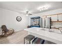 Bright kitchen features stainless steel appliances and a stylish island with seating at 5751 Hacienda Ave # 135, Las Vegas, NV 89122