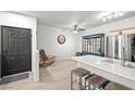 Inviting living room boasts natural light and a charming rocking chair at 5751 Hacienda Ave # 135, Las Vegas, NV 89122