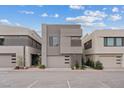 Contemporary home featuring a sleek, modern facade with a garage, complemented by minimalist landscaping at 16 Heron Harbour Dr, Henderson, NV 89011