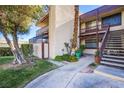 Condo exterior featuring a stairway, balcony, and well-maintained landscaping at 3168 S Eastern Ave # 45, Las Vegas, NV 89169