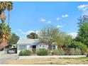 Inviting single-story house showcasing drought-tolerant landscaping, a covered carport, and a welcoming front entrance at 424 N 16Th St, Las Vegas, NV 89101