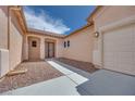 The home has a private entrance with double doors and mature landscaping at 7908 Morning Gallop Ct, Las Vegas, NV 89131