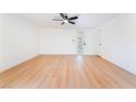 Inviting bedroom boasts wood floors, a ceiling fan, and ample natural light at 2878 El Cajon St, Las Vegas, NV 89169