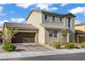 Charming home featuring a paved driveway, a two-car garage, and well-maintained landscaping at 10290 Lodge Pine Ave, Las Vegas, NV 89166