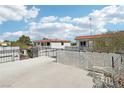 Condo building exterior featuring private patios, beautiful architectural details, and lush landscaping at 1101 Willow Tree Dr # D, Las Vegas, NV 89128