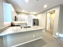 Well-lit kitchen featuring a large island with a sink, modern appliances, and ample storage space at 11236 Rainbow Peak Ave # 210, Las Vegas, NV 89135