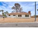 Charming single-story home with a well-maintained exterior, landscaped yard, and desert style landscape at 1400 Cottonwood Pl, Las Vegas, NV 89104