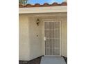 The front entrance of the home is protected with a screen door at 2260 Rugged Mesa Dr, Laughlin, NV 89029