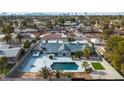 Expansive aerial view showcases the in-ground pool, landscaped backyard, and surrounding neighborhood at 2749 Horseshoe Dr, Las Vegas, NV 89120