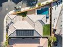 Aerial view of the backyard featuring pool, lounge area and artificial turf at 3062 Echoed Rondel Ln, Henderson, NV 89044