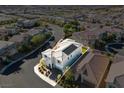 Aerial view of a modern home nestled in a residential area, outlined for emphasis on the property at 3062 Echoed Rondel Ln, Henderson, NV 89044