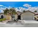 Beautiful single-story home features a low-maintenance front yard with desert landscaping, a covered porch, and an attached two-car garage at 3335 American Mustang Ct, Las Vegas, NV 89122