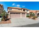 Charming two-story home highlighting a spacious three-car garage and well-manicured front yard at 3921 White Castle St, Las Vegas, NV 89129