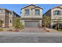 Lovely two-story home boasting a two-car garage, brick driveway, and low maintenance landscaping at 4066 Painted Lady Ave, Las Vegas, NV 89141