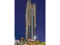 Striking exterior view of the Palms Place tower showcasing its modern architecture and illuminated facade at 4381 W Flamingo Rd # 2308, Las Vegas, NV 89103