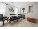 Elegant dining room with stylish chairs, a fireplace, and plenty of natural light at 4535 Sparwood Dr, Las Vegas, NV 89147