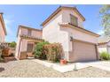 Charming two-story home featuring desert landscaping and a cozy front porch at 4535 Sparwood Dr, Las Vegas, NV 89147