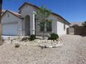 Attractive single story home in a desert landscaped front yard at 5240 Sweet William St, North Las Vegas, NV 89081