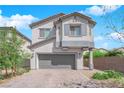 Charming two-story home features a well-manicured front yard, two-car garage, and a neutral color scheme at 5846 Bonita Rose St, Las Vegas, NV 89113