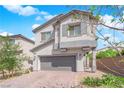 Charming two-story home boasts a well-manicured front yard, a gray two-car garage, and a neutral color scheme at 5846 Bonita Rose St, Las Vegas, NV 89113