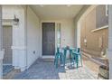 Cozy front porch with a table and chairs, offering a welcoming outdoor space at 6338 Selston Dr, North Las Vegas, NV 89081