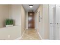 Hallway with tiled floors and access to a white door on the right at 8255 Las Vegas Blvd # 802, Las Vegas, NV 89123