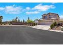Beautiful home exterior featuring desert landscaping and a spacious three-car garage; perfect for a Gathering at 8287 Lincoln Valley St, Las Vegas, NV 89123