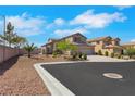 Attractive exterior view showcasing the home's three-car garage, desert landscaping, and well-maintained surroundings at 8287 Lincoln Valley St, Las Vegas, NV 89123