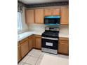 Modern kitchen featuring stainless steel appliances, including a gas range and microwave at 830 Carnegie St # 1811, Henderson, NV 89052