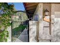 Inviting home entrance with wrought iron gate, stone steps, and detailed address plaque at 1905 Calle De Espana, Las Vegas, NV 89102